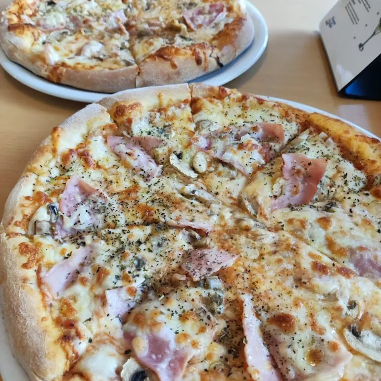 Freshly baked stone-oven pizza
